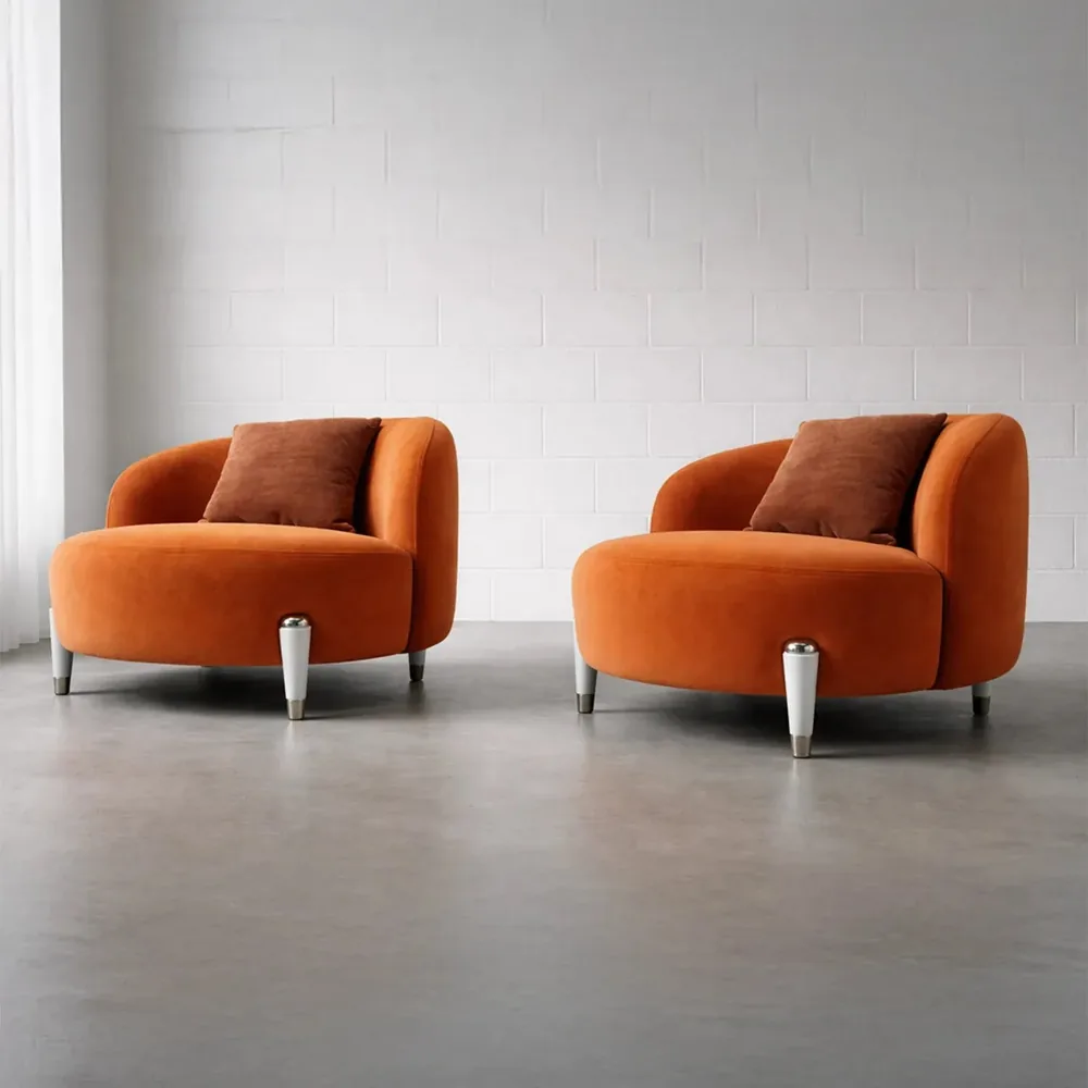 Two Contour Comfort chairs side by side on a plain grey floor against a white wall, showing their footprint